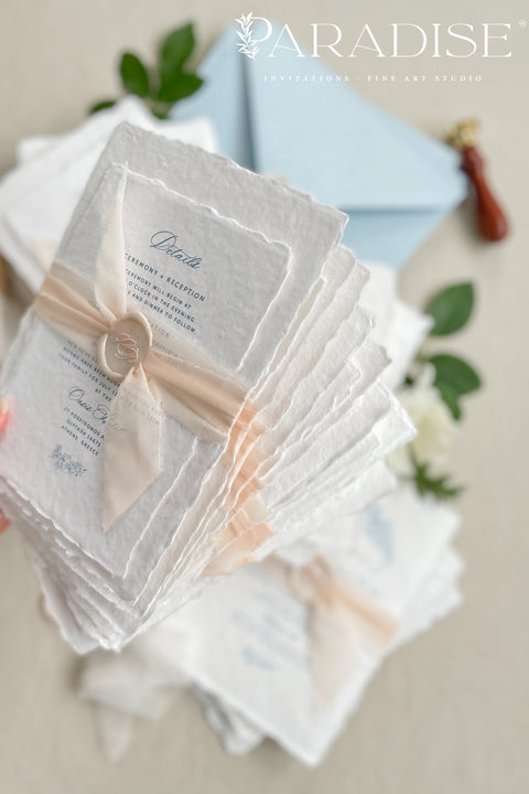 Announce your seaside celebration with these beautifully crafted handmade paper wedding invitations. Perfect for a beach wedding, this suite combines a relaxed, coastal feel with the refined elegance of artisan cotton rag paper. Each invitation features a delicate botanical design that evokes the natural beauty of the shoreline, from swaying palms to coastal foliage. The unique, deckled-edge paper adds a rustic, organic texture that is perfectly suited for a romantic oceanfront ceremony.