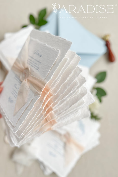 Announce your seaside celebration with these beautifully crafted handmade paper wedding invitations. Perfect for a beach wedding, this suite combines a relaxed, coastal feel with the refined elegance of artisan cotton rag paper. Each invitation features a delicate botanical design that evokes the natural beauty of the shoreline, from swaying palms to coastal foliage. The unique, deckled-edge paper adds a rustic, organic texture that is perfectly suited for a romantic oceanfront ceremony.