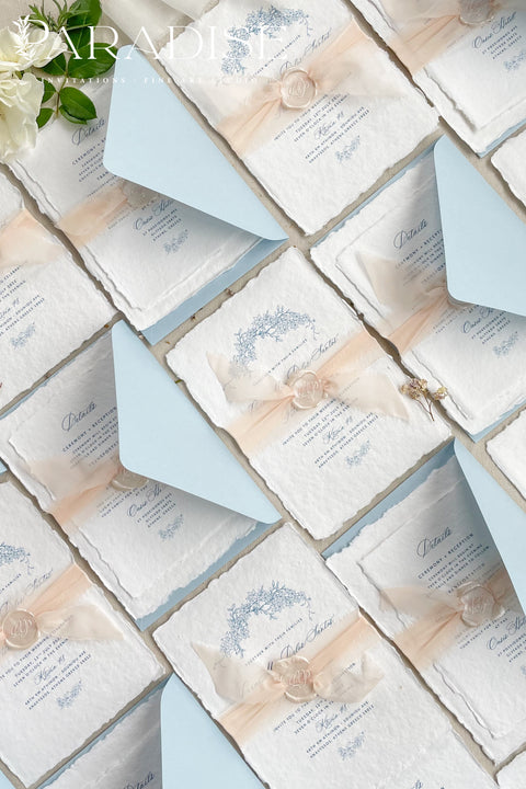 Announce your seaside celebration with these beautifully crafted handmade paper wedding invitations. Perfect for a beach wedding, this suite combines a relaxed, coastal feel with the refined elegance of artisan cotton rag paper. Each invitation features a delicate botanical design that evokes the natural beauty of the shoreline, from swaying palms to coastal foliage. The unique, deckled-edge paper adds a rustic, organic texture that is perfectly suited for a romantic oceanfront ceremony.
