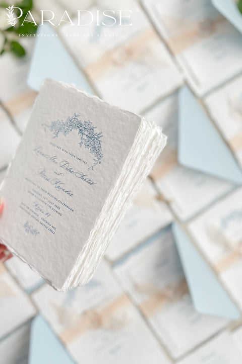 Announce your seaside celebration with these beautifully crafted handmade paper wedding invitations. Perfect for a beach wedding, this suite combines a relaxed, coastal feel with the refined elegance of artisan cotton rag paper. Each invitation features a delicate botanical design that evokes the natural beauty of the shoreline, from swaying palms to coastal foliage. The unique, deckled-edge paper adds a rustic, organic texture that is perfectly suited for a romantic oceanfront ceremony.