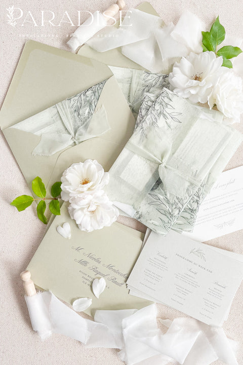 Bring natural elegance to your celebration with our vellum wedding invitations, designed with soft sage green accents, modern fine art typography, and translucent vellum wraps tied with ribbon. Each suite is crafted by hand to embody a refined yet organic aesthetic that perfectly suits botanical, garden, or destination weddings. Printed on premium cardstock with delicate botanical illustrations.