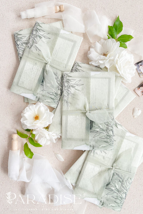 Bring natural elegance to your celebration with our vellum wedding invitations, designed with soft sage green accents, modern fine art typography, and translucent vellum wraps tied with ribbon. Each suite is crafted by hand to embody a refined yet organic aesthetic that perfectly suits botanical, garden, or destination weddings. Printed on premium cardstock with delicate botanical illustrations.