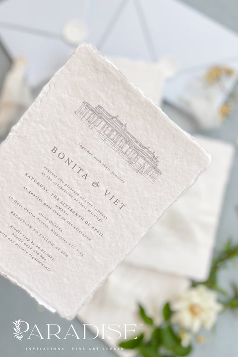 Announce your wedding with timeless sophistication through this handmade paper wedding invitation suite, featuring a hand-drawn illustration of your wedding venue - a keepsake that beautifully captures the heart of your celebration. Printed on luxury deckled-edge cotton paper. Wrapped softly with sheer ivory ribbon and paired with powder-blue envelopes sealed with wax, this suite balances elegance and sentiment, making every detail feel intentional and romantic.