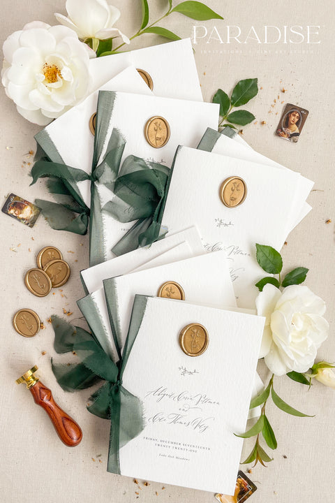 This wedding program brings together clean typography, luxurious cardstock, and rich green ribbon for a naturally elegant ceremony piece. Finished with a warm gold wax seal and botanical accents, it blends modern simplicity with traditional fine-art touches. Designed to complement garden, estate, and timeless wedding themes, it offers a polished presentation your guests will instantly admire.