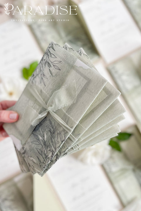 Bring natural elegance to your celebration with our vellum wedding invitations, designed with soft sage green accents, modern fine art typography, and translucent vellum wraps tied with ribbon. Each suite is crafted by hand to embody a refined yet organic aesthetic that perfectly suits botanical, garden, or destination weddings. Printed on premium cardstock with delicate botanical illustrations.