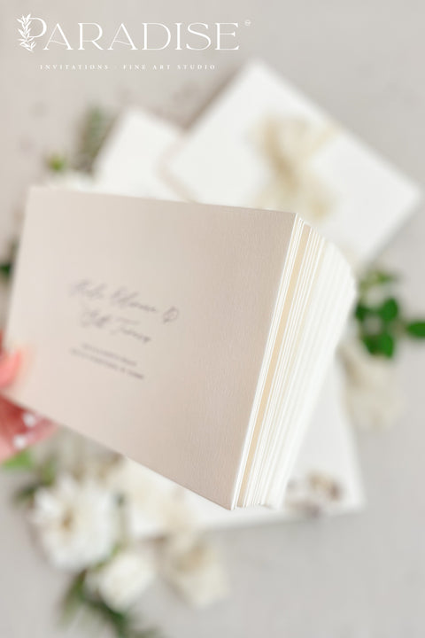Stack of coco linen envelopes with address printing displaying consistent color, textured paper surface, and structured luxury wedding stationery finish.