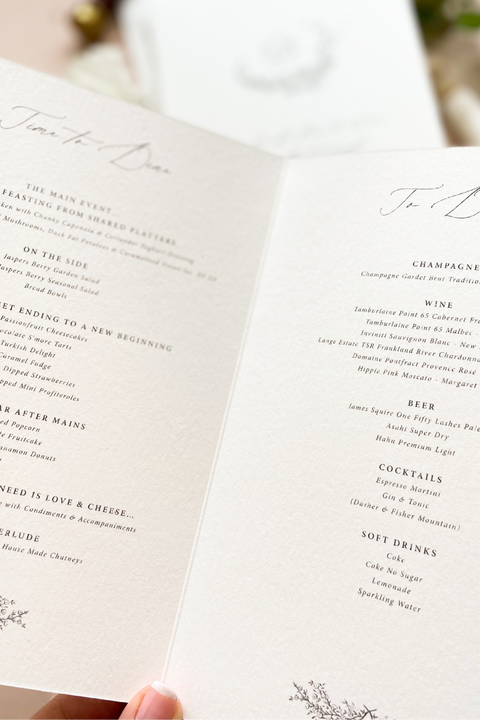 Refined and timeless, our booklet wedding menus are the perfect blend of artistry and sophistication. Printed on luxury textured cardstock, each booklet opens to reveal your curated dining and drink selections in a beautifully balanced layout. The botanical monogram design adds an elegant fine-art touch, while the soft neutral tones and minimalist typography create a polished, romantic aesthetic - ideal for luxury, garden, and destination weddings.