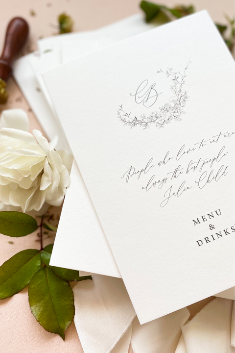 Refined and timeless, our booklet wedding menus are the perfect blend of artistry and sophistication. Printed on luxury textured cardstock, each booklet opens to reveal your curated dining and drink selections in a beautifully balanced layout. The botanical monogram design adds an elegant fine-art touch, while the soft neutral tones and minimalist typography create a polished, romantic aesthetic - ideal for luxury, garden, and destination weddings.