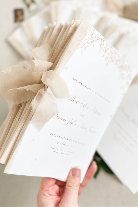 Warm, romantic, and refined - these wedding programs feature soft botanical illustrations paired with delicate chiffon ribbon for a timeless ceremony keepsake. Printed on premium cardstock with elegant typography, they bring an elevated aesthetic to your aisle décor. Perfect for classic, floral, and fine-art inspired weddings.