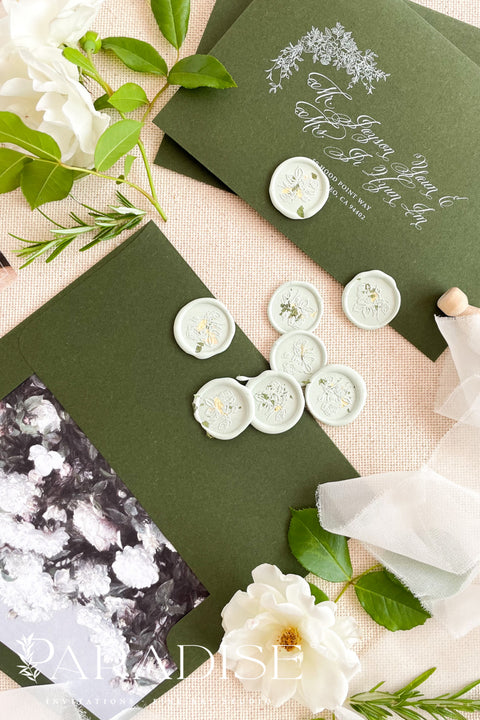 Soft sage wax seals bring a refined, nature-inspired finish to wedding invitations and fine-art stationery. Featuring delicate botanical impressions, each seal is handcrafted to add understated elegance, texture, and a timeless organic touch to your paper suite.&nbsp;Perfect for envelopes, vellum wraps, or place cards, these muted green wax seals complement botanical, garden, and modern romantic weddings beautifully.