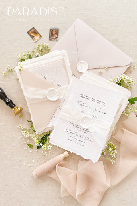 This exquisite wedding invites suite offers a blend of timeless sophistication and modern elegance. Designed with an eco-conscious approach, these luxury and timeless handmade invitations feature a beautiful modern calligraphy design and are printed on sustainable paper. The result is a truly unique and thoughtful suite that will leave a lasting impression on your guests.