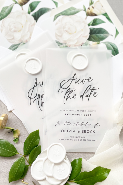 Announce your wedding with timeless sophistication through our vellum Save the Date cards, featuring modern calligraphy, translucent vellum overlay, and a hand-stamped white wax seal. Each card reveals a delicate floral print insert beneath the soft, semi-transparent layer - creating an elegant fine-art aesthetic that feels romantic and refined. Perfect for modern, botanical, or destination weddings.