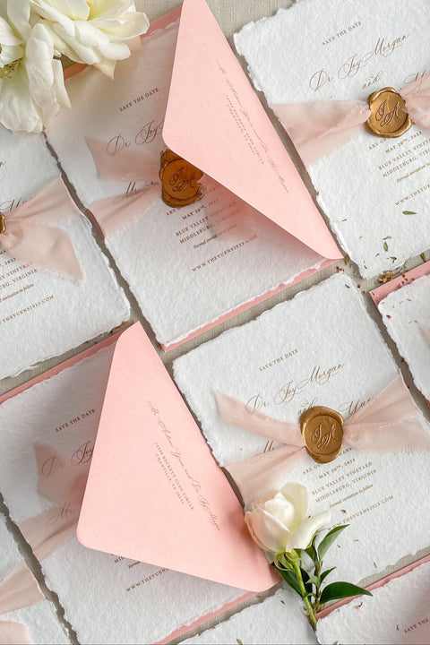 Celebrate your love story with our handmade paper Save the Date cards, thoughtfully designed for couples who cherish timeless elegance and artistry. Each card is printed on luxury 100% cotton handmade paper with softly torn deckled edges, wrapped in a delicate blush silk ribbon, and finished with a hand-pressed wax seal.