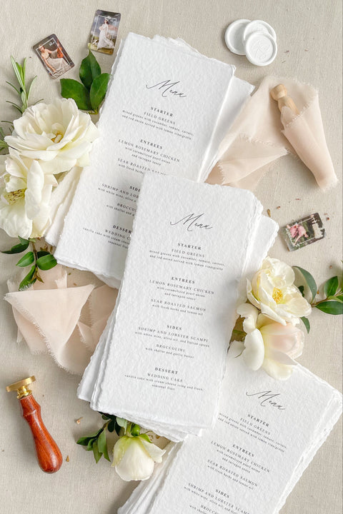 Elevate your tablescape with our handmade paper wedding menus, crafted from 100% cotton rag paper with elegant deckled edges. Each piece embodies timeless fine-art beauty, featuring minimalist typography and a tactile, organic texture that complements both romantic and modern weddings. Handmade with care using sustainable, tree-free materials, these menus are perfect for couples seeking eco-friendly luxury stationery.