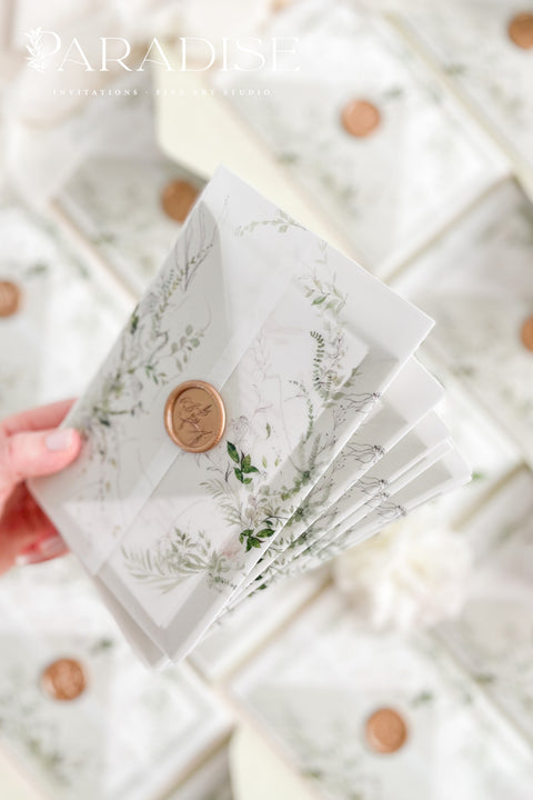 Invite your guests with elegance and charm through our botanical vellum wedding invitations, a handcrafted suite that captures the essence of romance and nature. Each invitation is wrapped in translucent vellum printed with delicate greenery illustrations, tied with a warm copper wax seal, and paired with sage green envelopes for a naturally refined look. Perfect for garden, outdoor, fine art, or destination weddings.