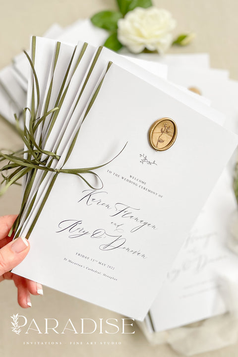 This wedding program is thoughtfully designed with clean typography, soft white cardstock, and an olive green ribbon tied by hand for a naturally elegant finish. A warm gold wax seal adds a touch of old-world charm, creating a harmonious blend of modern minimalism and classic detail. Perfect for couples who want a quiet, graceful aesthetic, this program offers a polished way to present your ceremony with style and intention.