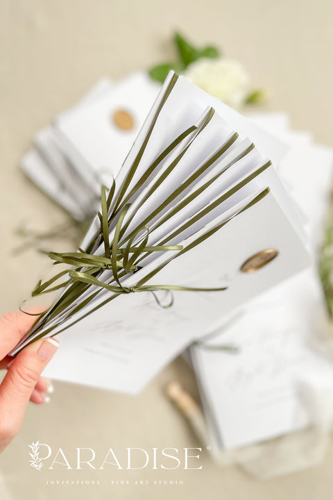 This wedding program is thoughtfully designed with clean typography, soft white cardstock, and an olive green ribbon tied by hand for a naturally elegant finish. A warm gold wax seal adds a touch of old-world charm, creating a harmonious blend of modern minimalism and classic detail. Perfect for couples who want a quiet, graceful aesthetic, this program offers a polished way to present your ceremony with style and intention.