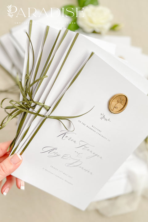 This wedding program is thoughtfully designed with clean typography, soft white cardstock, and an olive green ribbon tied by hand for a naturally elegant finish. A warm gold wax seal adds a touch of old-world charm, creating a harmonious blend of modern minimalism and classic detail. Perfect for couples who want a quiet, graceful aesthetic, this program offers a polished way to present your ceremony with style and intention.