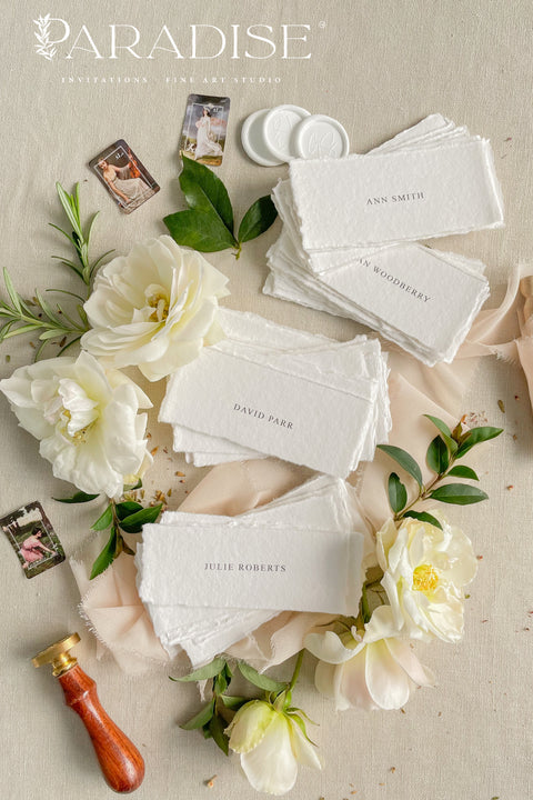 Add refined simplicity to your event with our handmade paper place cards, crafted from premium cotton rag paper and finished with naturally torn deckled edges. Each name tag features minimalist printed lettering and a soft fine-art aesthetic, making them perfect for weddings, rehearsal dinners, intimate gatherings, and elegant celebrations. These artisan-crafted cards bring understated beauty, organic texture, and timeless charm to any tablescape.