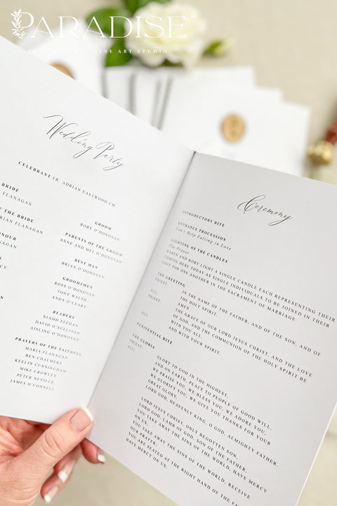 This wedding program is thoughtfully designed with clean typography, soft white cardstock, and an olive green ribbon tied by hand for a naturally elegant finish. A warm gold wax seal adds a touch of old-world charm, creating a harmonious blend of modern minimalism and classic detail. Perfect for couples who want a quiet, graceful aesthetic, this program offers a polished way to present your ceremony with style and intention.