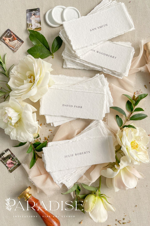 Add refined simplicity to your event with our handmade paper place cards, crafted from premium cotton rag paper and finished with naturally torn deckled edges. Each name tag features minimalist printed lettering and a soft fine-art aesthetic, making them perfect for weddings, rehearsal dinners, intimate gatherings, and elegant celebrations. These artisan-crafted cards bring understated beauty, organic texture, and timeless charm to any tablescape.