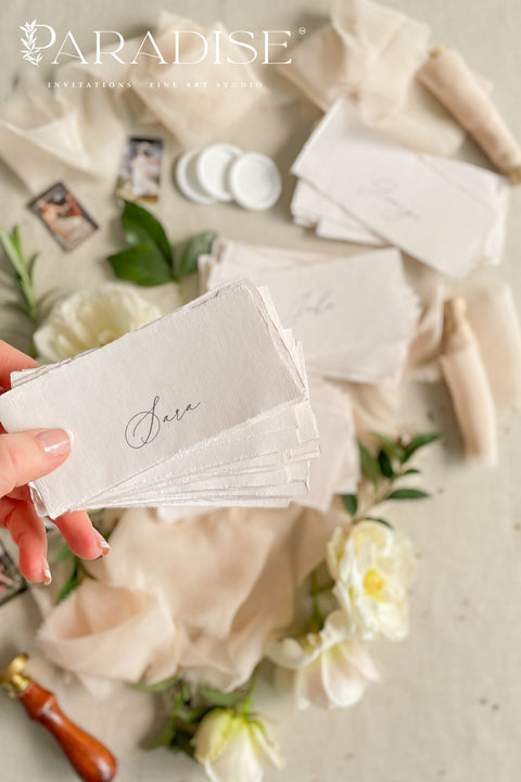 Elevate your event with our handmade paper place cards, crafted from luxurious cotton rag paper and finished with naturally torn deckled edges. Each name tag features elegant calligraphy and a soft fine-art aesthetic, making them ideal for weddings, intimate dinners, bridal showers, and high-end celebrations. These artisan-crafted cards bring refined texture, timeless charm, and a beautifully romantic look to any tablescape.
