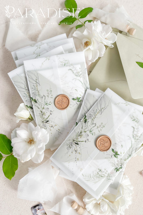 Invite your guests with elegance and charm through our botanical vellum wedding invitations, a handcrafted suite that captures the essence of romance and nature. Each invitation is wrapped in translucent vellum printed with delicate greenery illustrations, tied with a warm copper wax seal, and paired with sage green envelopes for a naturally refined look. Perfect for garden, outdoor, fine art, or destination weddings.