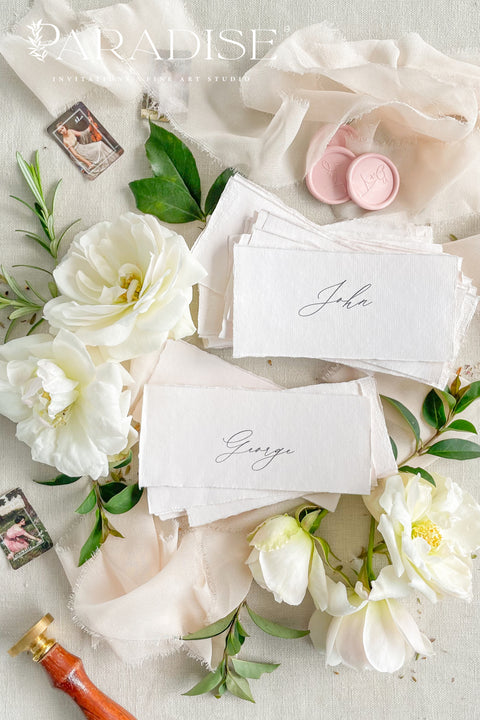 Elevate your event with our handmade paper place cards, crafted from luxurious cotton rag paper and finished with naturally torn deckled edges. Each name tag features elegant calligraphy and a soft fine-art aesthetic, making them ideal for weddings, intimate dinners, bridal showers, and high-end celebrations. These artisan-crafted cards bring refined texture, timeless charm, and a beautifully romantic look to any tablescape.