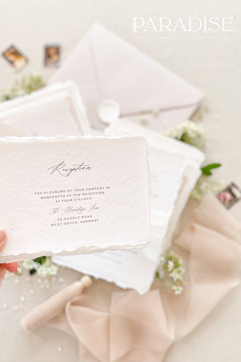 This exquisite wedding invites suite offers a blend of timeless sophistication and modern elegance. Designed with an eco-conscious approach, these luxury and timeless handmade invitations feature a beautiful modern calligraphy design and are printed on sustainable paper. The result is a truly unique and thoughtful suite that will leave a lasting impression on your guests.