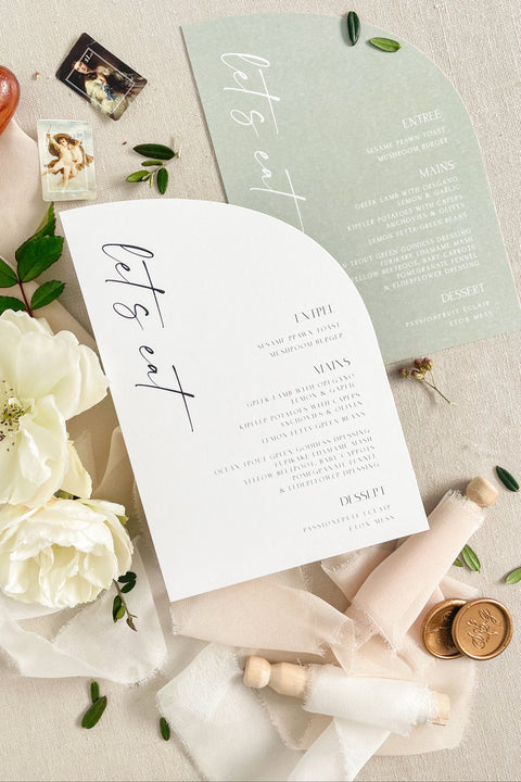 Add a touch of modern charm to your tablescape with our half arch wedding menus, featuring minimalist typography and soft contemporary hues. Printed on premium textured cardstock, these menus perfectly blend fine-art aesthetics with clean, modern lines. Ideal for romantic garden celebrations or elegant minimalist weddings, they bring sophistication and style to every table setting.