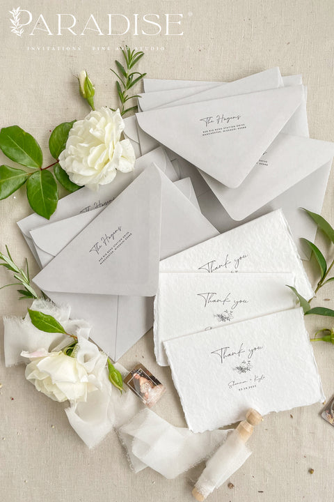 Express gratitude with understated elegance through these handmade paper thank you cards. Crafted from luxurious cotton rag paper with naturally deckled edges, each card features refined typography and a soft, minimalist aesthetic. Designed to pair beautifully with fine-art wedding stationery, these cards offer a timeless way to thank your guests while becoming a keepsake they’ll cherish long after your celebration.