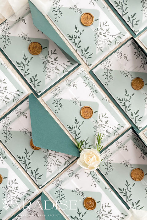 Romantic, refined, and inspired by nature - our botanical vellum wedding invitations are crafted for couples who love timeless design with an organic touch. Each invitation features delicate greenery illustrations, wrapped in a translucent vellum sleeve and sealed with a gold wax seal for an elegant, fine art finish. The deep emerald and sage green envelopes perfectly complement the natural botanical design.