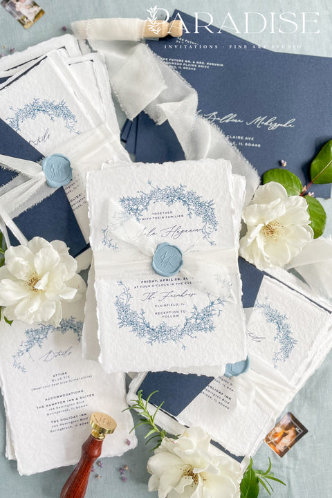 Set a sophisticated and thoughtful tone for your coastal celebration with these unique wedding invites. Perfect for a beach wedding, this suite features a classic navy theme with a beautifully designed wedding timeline to guide your guests through your special day. The elegant calligraphy design adds a touch of classic romance, while the eco-conscious materials ensure your stationery is a beautiful and responsible choice for your special day.