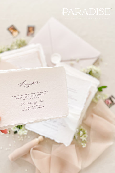 This exquisite wedding invites suite offers a blend of timeless sophistication and modern elegance. Designed with an eco-conscious approach, these luxury and timeless handmade invitations feature a beautiful modern calligraphy design and are printed on sustainable paper. The result is a truly unique and thoughtful suite that will leave a lasting impression on your guests.
