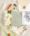 This half arch wedding invitation suite blends modern minimalism with soft botanical charm - perfect for couples who adore natural tones and elegant simplicity. The sage green half-arch invitation features contemporary typography, paired beautifully with neutral envelopes, blush ribbons, and gold wax seals, creating a look that’s refined yet organic. Printed on luxury cardstock, each invitation feels substantial and smooth to the touch, making it both a visual and tactile delight.