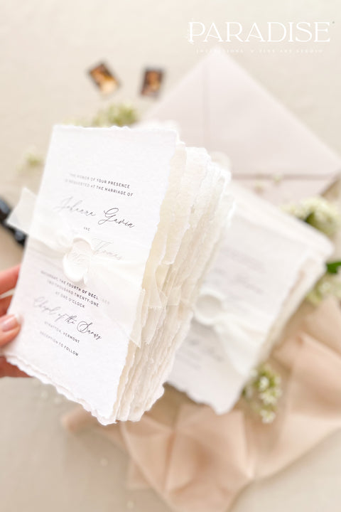 This exquisite wedding invites suite offers a blend of timeless sophistication and modern elegance. Designed with an eco-conscious approach, these luxury and timeless handmade invitations feature a beautiful modern calligraphy design and are printed on sustainable paper. The result is a truly unique and thoughtful suite that will leave a lasting impression on your guests.