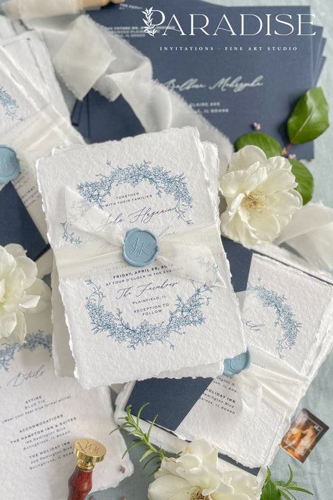 Set a sophisticated and thoughtful tone for your coastal celebration with these unique wedding invites. Perfect for a beach wedding, this suite features a classic navy theme with a beautifully designed wedding timeline to guide your guests through your special day. The elegant calligraphy design adds a touch of classic romance, while the eco-conscious materials ensure your stationery is a beautiful and responsible choice for your special day.