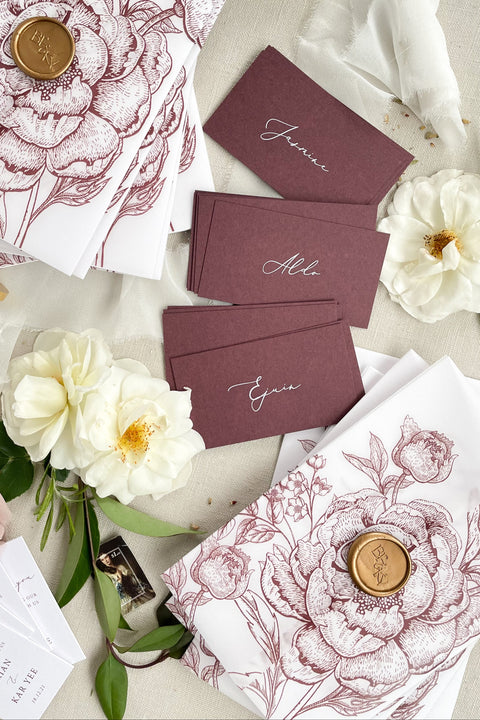 Make a bold, refined statement with our burgundy place cards, designed from premium heavyweight cardstock and finished with elegant calligraphy. Their rich, deep color adds dramatic sophistication to weddings, rehearsal dinners, galas, and modern celebrations. Whether styled with fine-art florals or paired with minimalist décor, these place cards bring effortless luxury, contrast, and warmth to any tablescape.