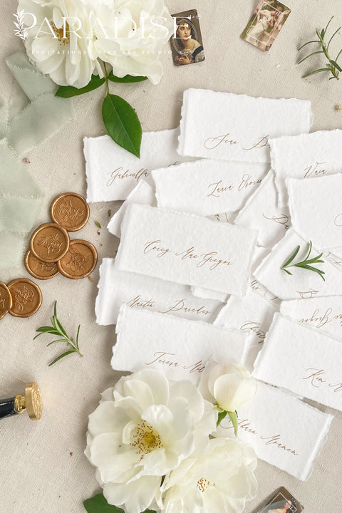 Create a romantic, fine-art tablescape with our handmade paper place cards, crafted from luxurious cotton rag paper and finished with soft, torn deckled edges. Each card features elegant calligraphy, delicate chiffon ribbon, and a timeless organic texture - perfect for weddings, intimate dinners, bridal showers, or upscale celebrations. These artisan-crafted pieces bring softness, refinement, and natural beauty to any seating display.