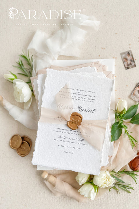 Announce your love story with timeless elegance through our&nbsp;handmade deckled-edge wedding invitations, beautifully detailed with soft blush tones, sheer ribbon, and custom wax seals. Each invitation is carefully crafted by hand using premium cotton paper for a naturally textured, fine art finish that embodies romance and sophistication.