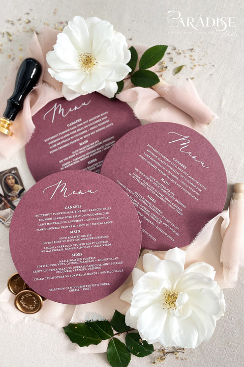 Elevate your reception styling with our burgundy circle wedding menus, designed to blend modern elegance with romantic depth. Printed on luxury matte cardstock in a rich wine shade, these round menus make a stunning statement at each place setting. Their clean, minimalist layout and distinctive shape create a refined aesthetic perfect for autumn soirées, vineyard weddings, or fine-art celebrations.