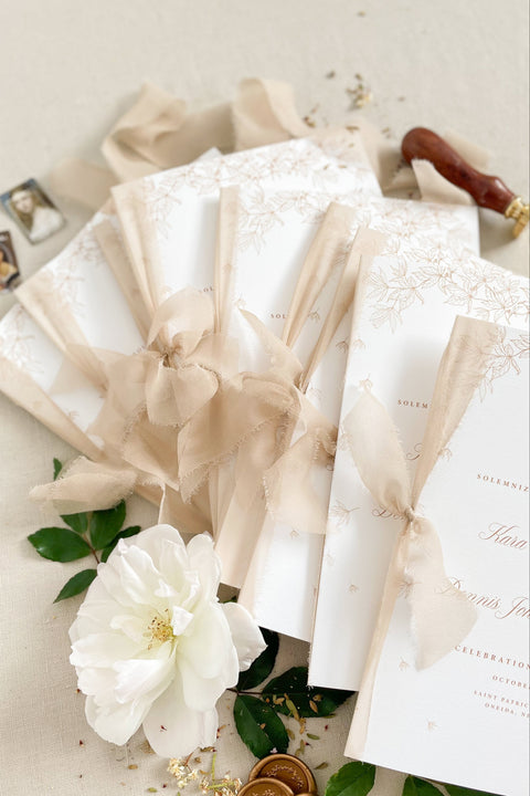Warm, romantic, and refined - these wedding programs feature soft botanical illustrations paired with delicate chiffon ribbon for a timeless ceremony keepsake. Printed on premium cardstock with elegant typography, they bring an elevated aesthetic to your aisle décor. Perfect for classic, floral, and fine-art inspired weddings.