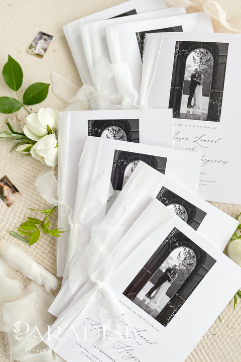 A beautifully printed ceremony program featuring your favorite photograph, wrapped in soft chiffon ribbon and crafted on luxurious fine-art paper. The design blends modern minimalism with heartfelt storytelling - allowing your guests to step into your love story the moment they take their seat. With its elegant typography, timeless black-and-white imagery, and heirloom-quality materials, it becomes more than a program - it becomes a cherished keepsake of your day.