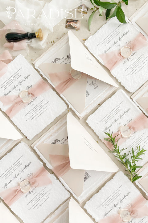 This handmade paper wedding invitation suite brings artistry and sentiment together. Each piece is printed on luxurious cotton paper with deckled edges, giving it a naturally soft and organic texture. The highlight of this suite is your custom hand-drawn map, created exclusively for your wedding to showcase your venue and key locations in elegant line art. Paired with blush silk ribbon, ivory envelopes, and a matching wax seal.