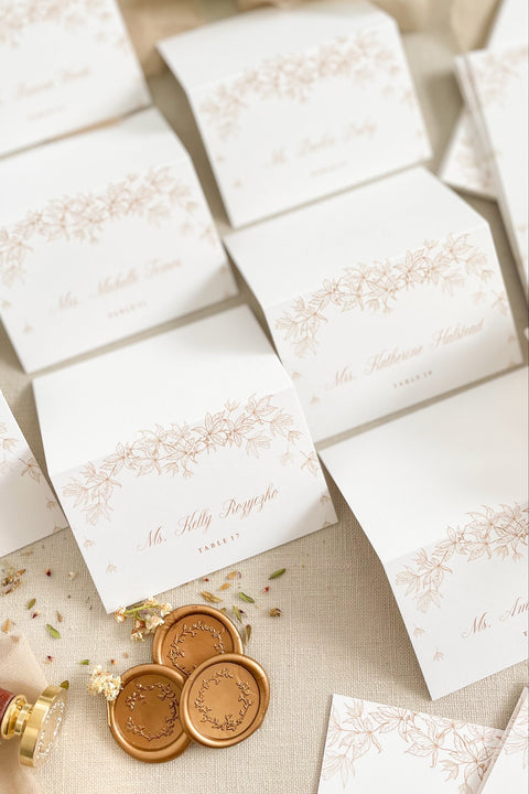 Elevate your table styling with our place cards, designed on premium cardstock and adorned with an elegant botanical illustration. Their refined aesthetic blends beautifully with classic, romantic, and fine-art wedding themes, offering a polished and cohesive look for any event. These folded cards stand effortlessly on tables, providing both function and graceful sophistication for your seating arrangements.