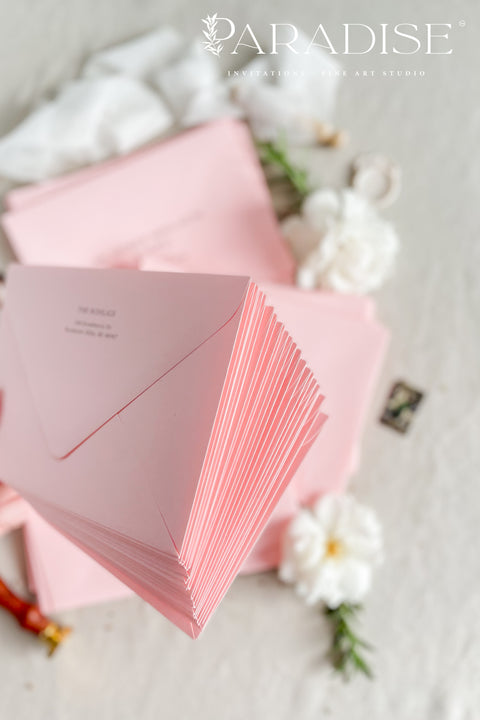 Dusty pink wedding envelopes with professional address printing, crafted from premium paper and styled to show soft color, smooth texture, and refined typography.