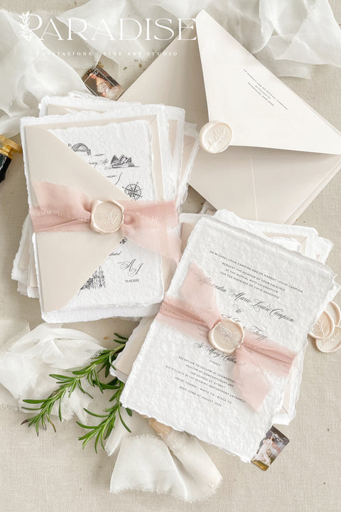 This handmade paper wedding invitation suite brings artistry and sentiment together. Each piece is printed on luxurious cotton paper with deckled edges, giving it a naturally soft and organic texture. The highlight of this suite is your custom hand-drawn map, created exclusively for your wedding to showcase your venue and key locations in elegant line art. Paired with blush silk ribbon, ivory envelopes, and a matching wax seal.