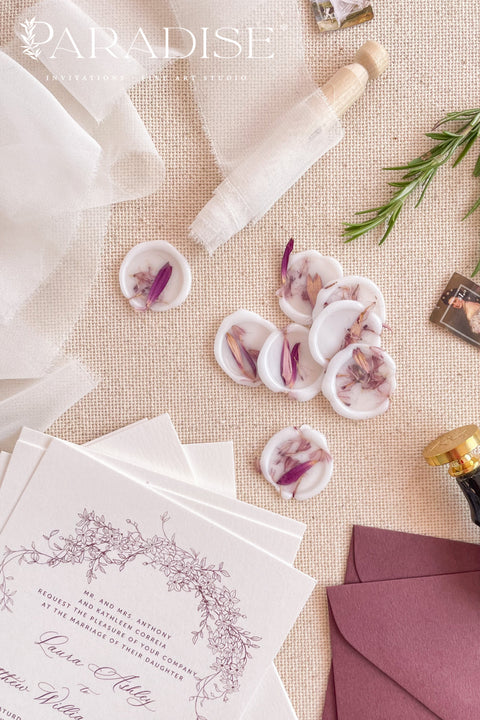 Delicately translucent vellum wax seals bring an ethereal finishing touch to fine-art invitations, envelopes, and day-of paper goods. Each seal is hand-poured in soft ivory wax and embedded with real dried botanicals, creating a romantic, organic accent that feels timeless yet modern. Perfect for weddings, christenings, bridal showers, and heirloom stationery designs, these wax seals add texture, depth, and understated luxury to your paper suite.