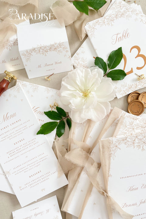 Clean white cardstock paired with rich copper typography creates a beautifully modern yet romantic table number design. Delicate botanical borders add a soft, ornamental touch, giving each card a refined and cohesive wedding-day presence. Perfect for elegant, garden, rustic-chic, or contemporary celebrations, this style blends minimalist clarity with decorative charm.