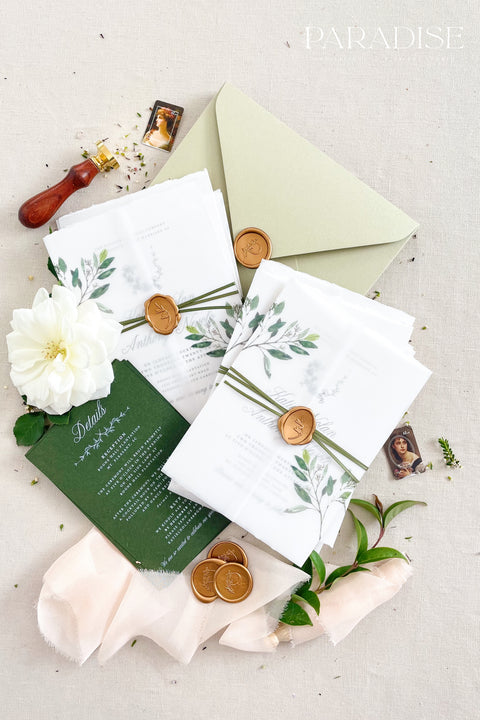 This botanical wedding invitation suite embodies effortless sophistication. Printed on luxury deckled-edge cotton paper, each piece is adorned with a delicate botanical motif and your custom monogram, creating a beautiful balance of refinement and intimacy. Wrapped in a vellum jacket featuring soft greenery details and tied with an olive silk ribbon, this suite exudes quiet romance - the kind inspired by nature, craftsmanship, and heartfelt storytelling.